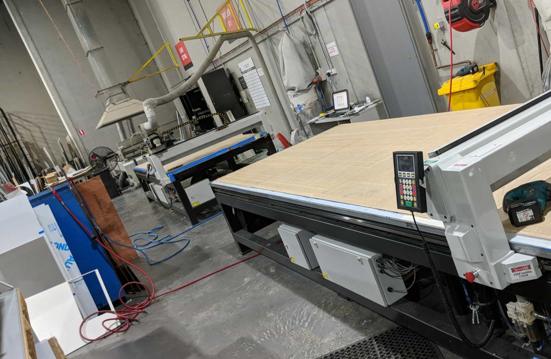 Two CNC router tables installed in the production workshop
