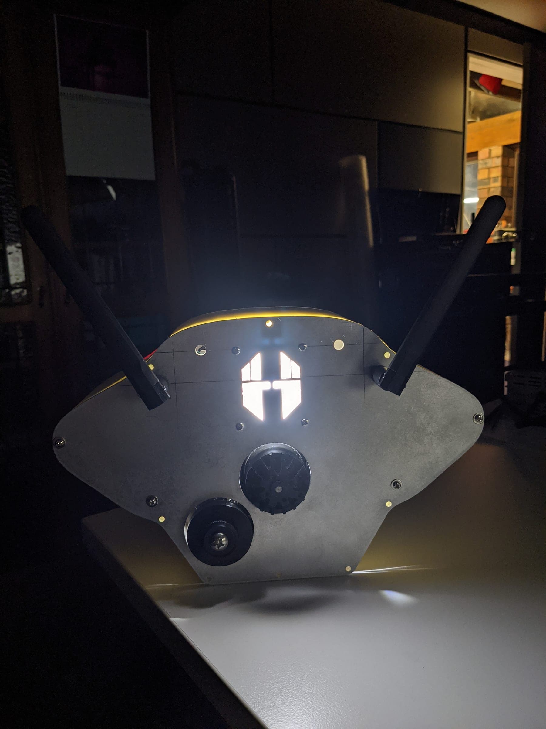 Camera car indoors with the Fliight logo illuminated on the front panel