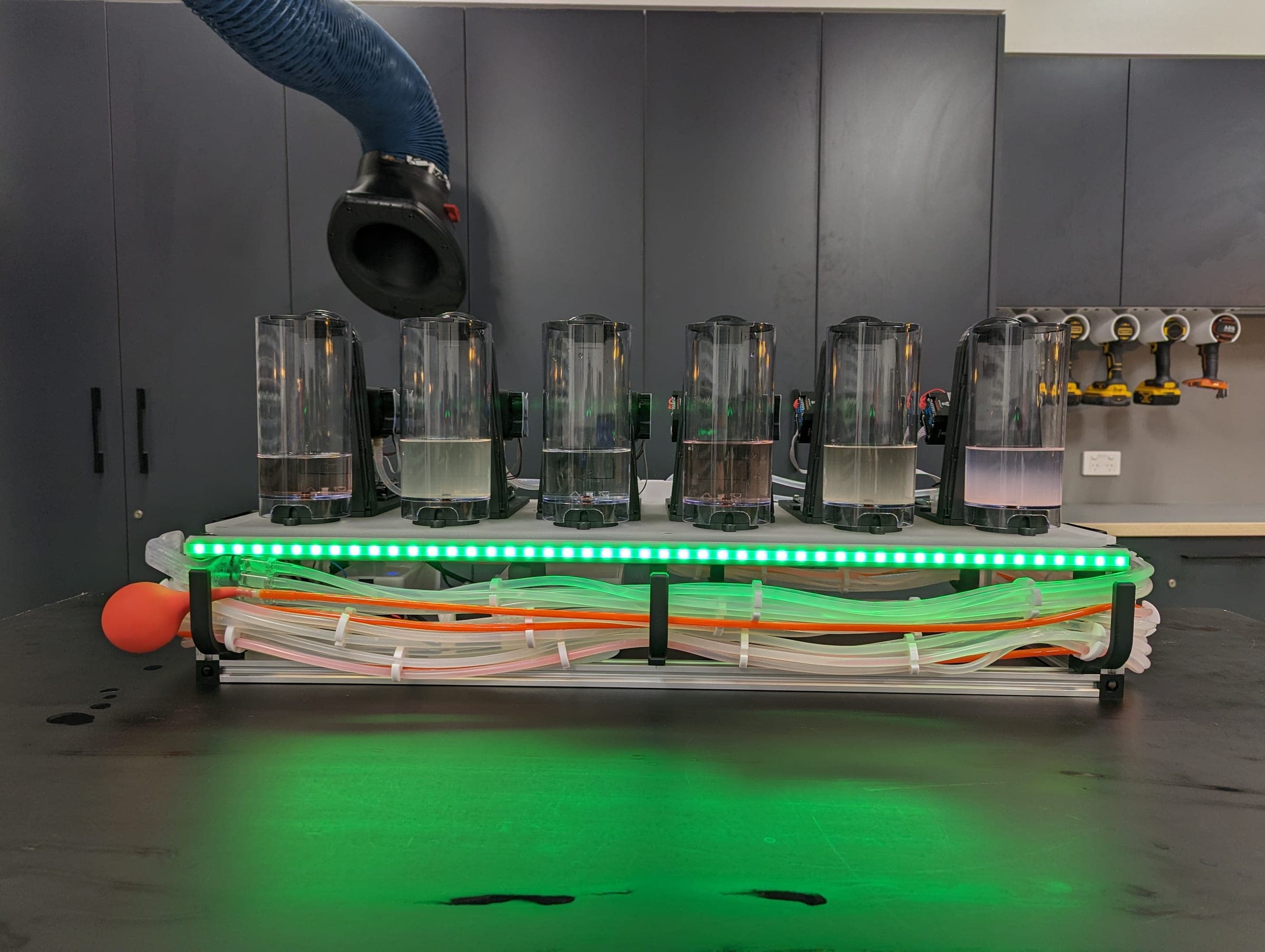 Six-channel gustometer with fluid reservoirs, colour-coded tubing and its illuminated status bar