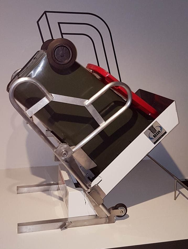 Profile view of the T-Bin exhibition display showing the bin-support and rotation structure
